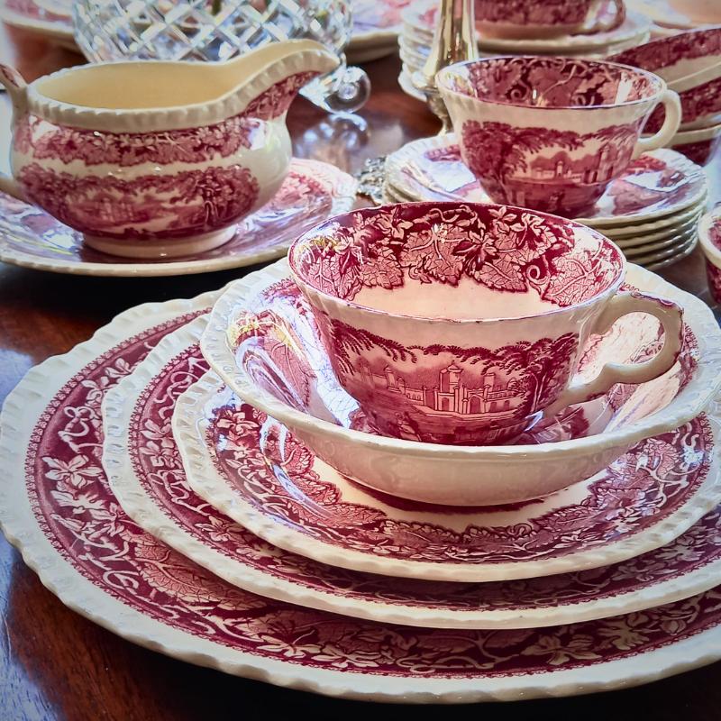 Tableware.  Photo of antique pink and cream plates and bowls.